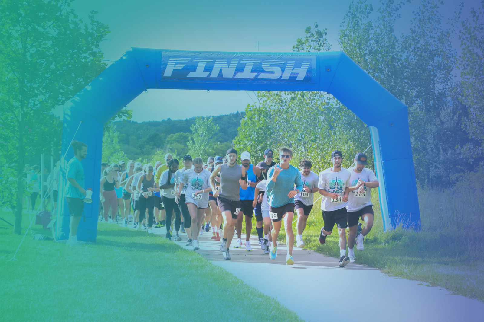 Group high-fiving with color powder